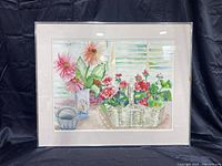 Full view of the framed watercolor painting showing the composition of flowers in a basket and vase by a window.
