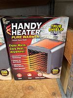 Front side of the box showing product name, image of the heater, wattage, and key features like advanced ceramic technology, air cleaning, adjustable timer and speeds, and quiet operation.