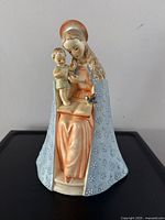 Front view showing the Madonna, child, and bird with detailed colors and facial features.