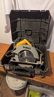 DeWalt circular saw inside case showing blade and handle