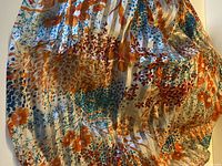 Full view of the silk chiffon fabric showing overall pattern and drape