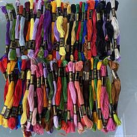 All 100 skeins arranged in rows showing colour variety