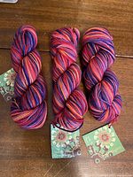 Three skeins with attached tags