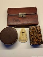 All four sewing kits closed to show exterior materials and forms