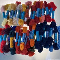 Assorted skeins laid out showing colours and labels
