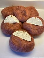 Group of yarn balls showing quantity and color