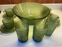 Full set showing bowl, tumblers, cups and saucers