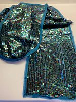 Full view of folded sequinned silk chiffon fabric