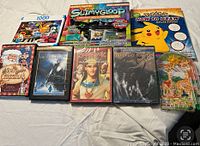 Overview photo showing all items including puzzles, DVDs, slime kit, and drawing book