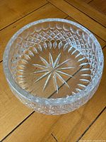 Top view of a heavy crystal bowl showing detailed star and diamond pattern cuts
