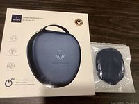 Front of box showing midnight blue ultra thin smart case with handle, labeled for AirPods Max
