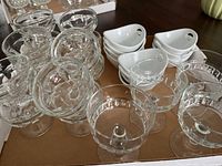 Full set of three styles of dessert dishes including clear glass and white ceramic pieces.