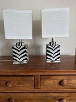 Pair of vintage table lamps on a wooden dresser, showing overall design and size.