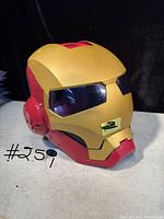 Ironman helmet front angled view showing gold and red coloring and tinted eyepieces.