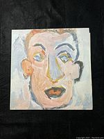 Front cover of vinyl album showing abstract painted face artwork