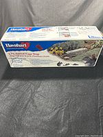 Front side of the Havahart live animal cage trap box showing the brand, model number 1025, and usage instructions for capturing squirrels and similar-sized animals.