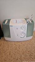 Kenmore humidifier showing front view with control panel and power cord.