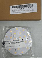 Four COB LED light chip beads in clear plastic packaging on brown cardboard with label showing 'COB LED Light Chip Bead 1 White 4PCS MADE IN CHINA'.