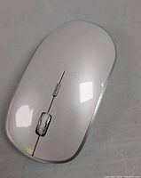 Front side of the white wireless mouse showing buttons and scroll wheel.