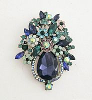 Front view of the large multi-color rhinestone brooch showing detailed arrangement of rhinestones.
