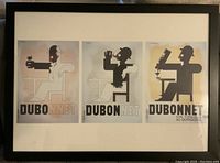 Framed set of three Dubonnet vintage style prints featuring stylized silhouetted figures drinking Dubonnet, black frame with white mat.