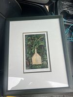 Framed art print depicting a white church in a forest, titled 'Church In The Forest' by Emily Carr, with signature and details visible on bottom right.