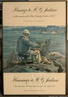 Framed exhibition poster titled 'Homage to A.Y. Jackson' showing a man sketching outdoors with a dog beside him, commemorating the artist's 100th birthday in 1972.
