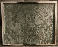 Metal print artwork showing abstract human figures in metallic shades inside a light-colored frame on a fabric surface.