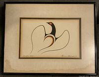 Framed Native Print artwork with a stylized bird in black, white, and brown tones. The print is signed and numbered and mounted on a beige mat with some discoloration, all within a black frame.
