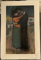 Photograph of art print showing two figures embracing with visible signature and slight creasing on the print.