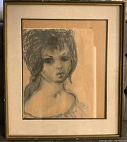 Framed signed etching of a woman in monochrome on aged paper.