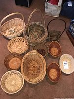 Photo showing 10 assorted woven baskets in various sizes, shapes, and colors arranged on carpet.