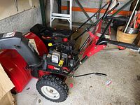 Right-side view showing engine, auger housing, wheel tread