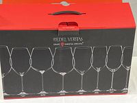Front of box showing outlines of 8 different wine glass shapes with the Riedel Veritas branding and the phrase 'Grape Varietal Specific'.