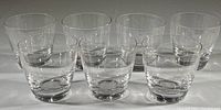 Group photo of seven clear crystal old fashioned glasses arranged in rows, showing consistent size and shape.