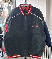 Front view of black winter jacket with zipper, Dodge Motorsports logo on chest, and striped ribbing on collar, cuffs, and hem.