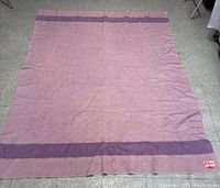 Full view of the wool blanket laid flat showing color, stripes, and approximate size.