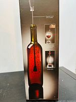 Photo of the aerator stem inserted into a filled wine bottle demonstrating aeration functionality.