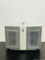 Front view of the Holmes twin ceramic space heater showing dual heating elements and center control panel.
