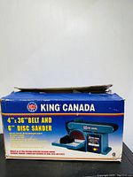 Original box of King Canada belt and disc sander with product image and branding.