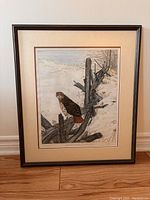 Full view of framed owl painting showing the owl perched on broken tree branches in a winter landscape.