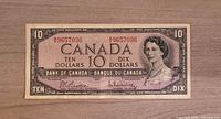 Front of 1954 Canadian $10 Bank of Canada banknote showing Queen Elizabeth II and serial number 9657036.