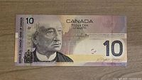 Front side of the 2005 Canada $10 banknote showing Sir John A. Macdonald portrait and denomination.