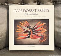 Front cover of book showing colorful bird artwork