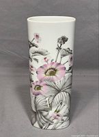 Front view of cylindrical porcelain vase with gray leaves and pink flowers design.