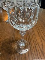 Single wine glass showing the cut-glass Gardon pattern, faceted stem, and round base