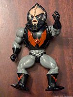 Front view of 1985 He-Man Hordak action figure showing detailed sculpt and paintwork including skull face, helmet, and bat emblem on chest.