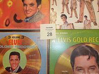 Four Elvis Presley Golden Records LP albums with cover art: Vol 1 orange cover, Vol 2 white with Elvis in gold suit, Vol 3 gold record design blue border, Vol 4 gold record green background.