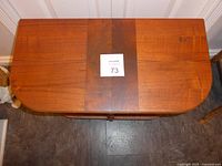 Top view showing rectangular inlaid walnut center panel with oak surrounding sides.