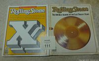 Two Rolling Stone magazines side by side; left is the 20th Anniversary edition with yellow cover and prominent X, right is The 100 Best Albums 1967-87 edition with a gold record on white cover.